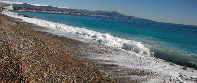 The pebble beach in Antibes is perfect for a stroll in the summer sun
