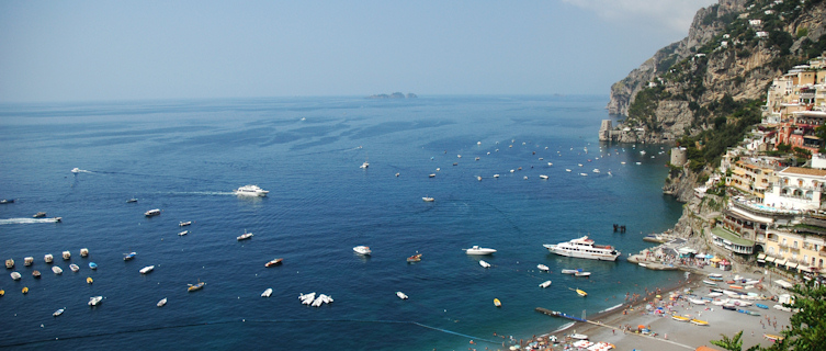 Swim in the crystal clear waters or relax on the sandy beaches of the picturesque Amalfi Coast