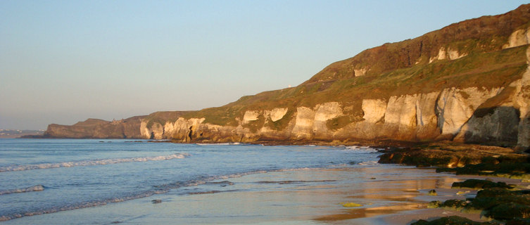 Portrush's White Rocks Beach is backed by dramatic limestone cliffs